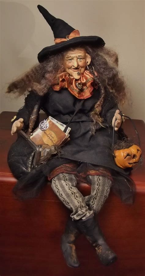 Sitting witch puppet with robotic movements
